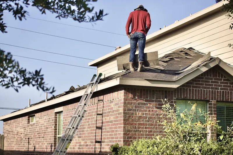 Professional roofer working on a residential roof in Dresden